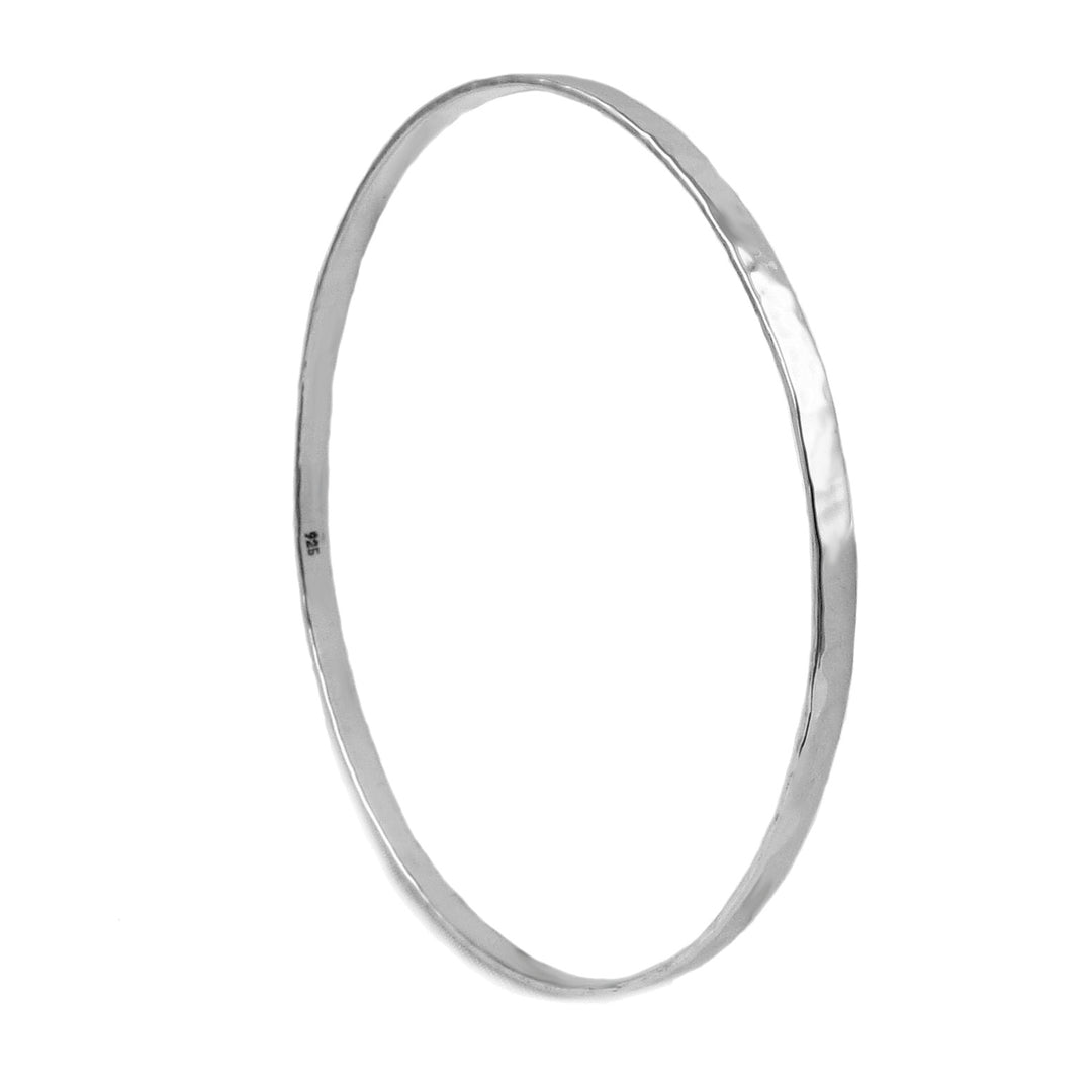 A single silver bangle with a hand-hammered finish presented on a plain background.