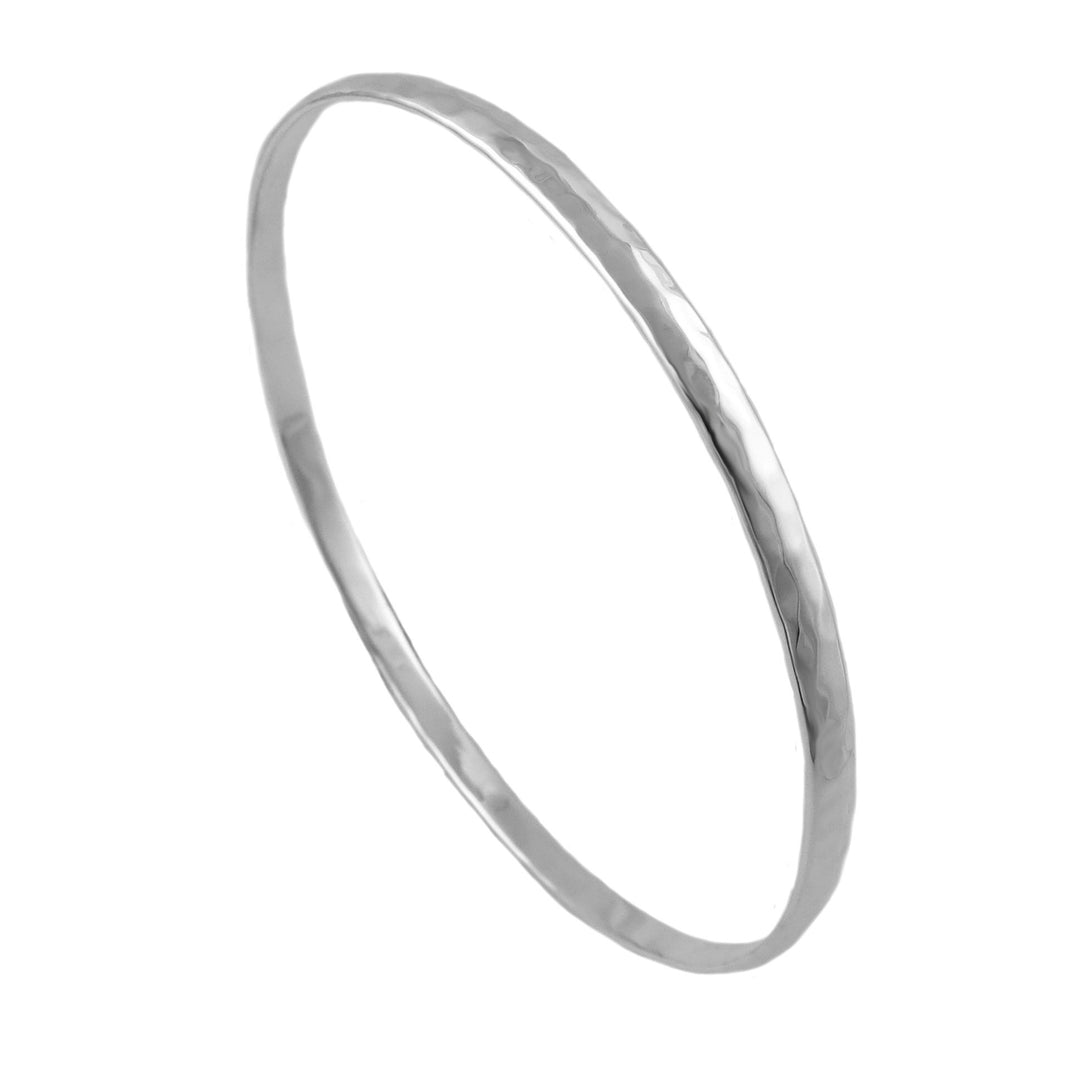 A large hammered sterling silver circle bangle for women displayed on a plain background.