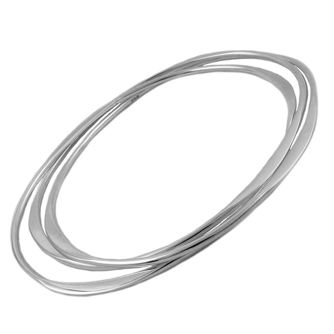 A sterling silver multi-bangle stack consisting of three interlocking oval bangles on a white background.