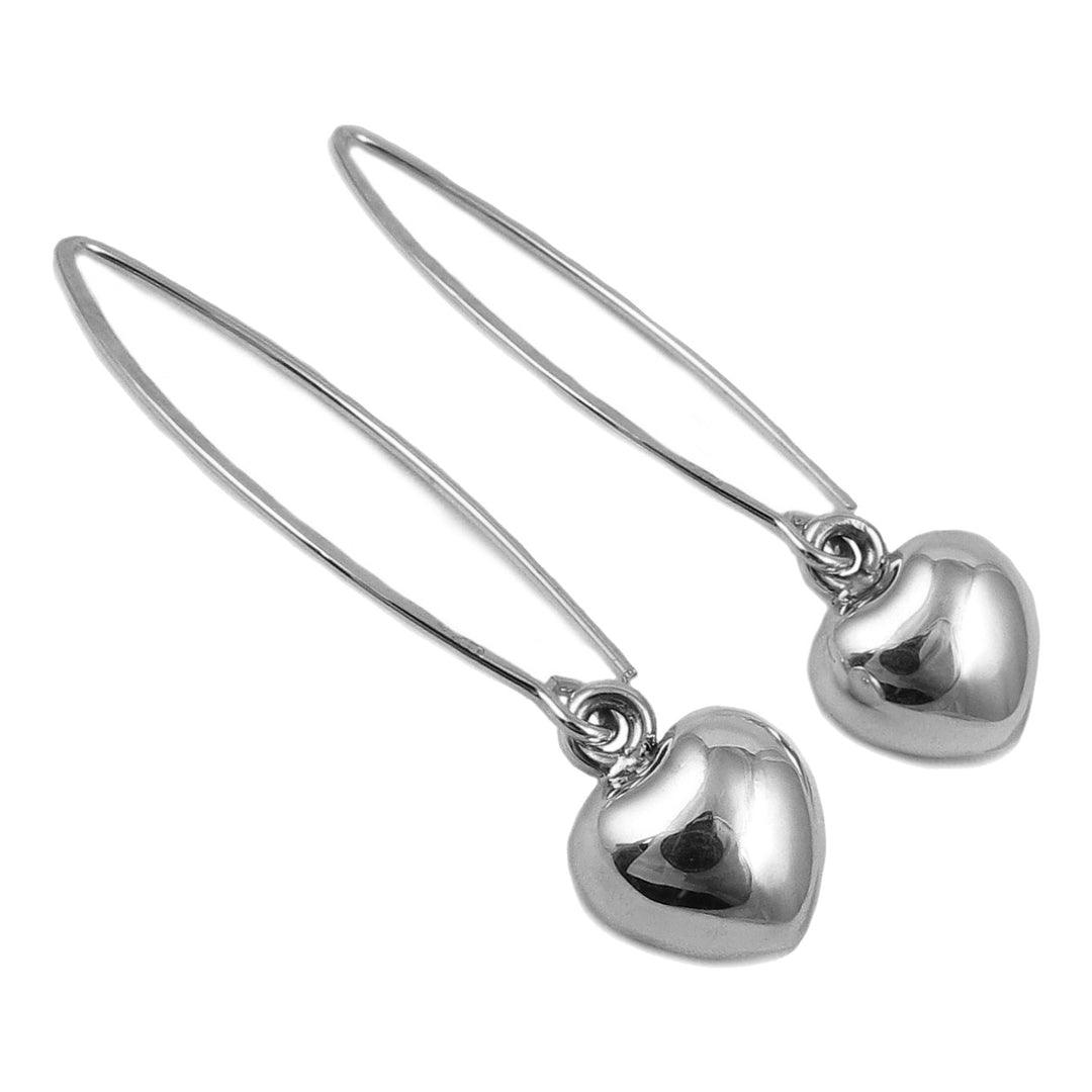 A pair of long sterling silver threader earrings with heart-shaped pendants, displayed against a white background.
