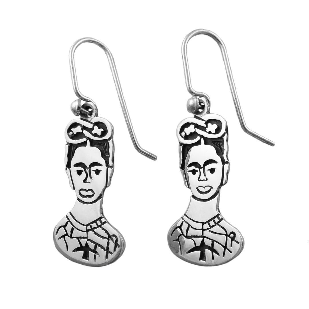 Mexican artist silver earrings on a white background.