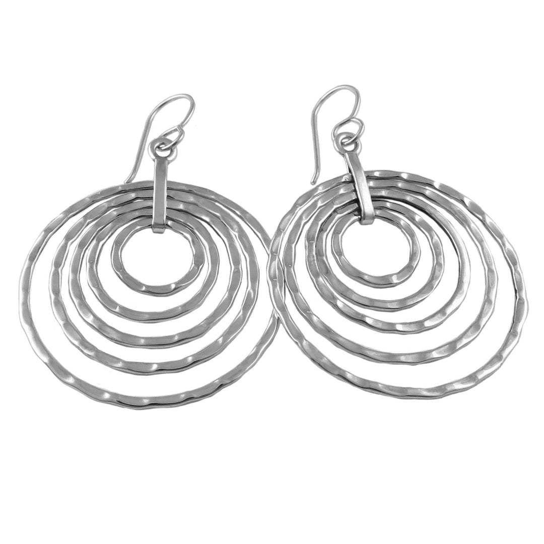 Silver multi hoop drop earrings on a white background
