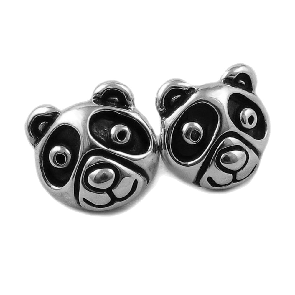 A pair of sterling silver stud earrings crafted in the shape of panda bears with blackened niello detailing.