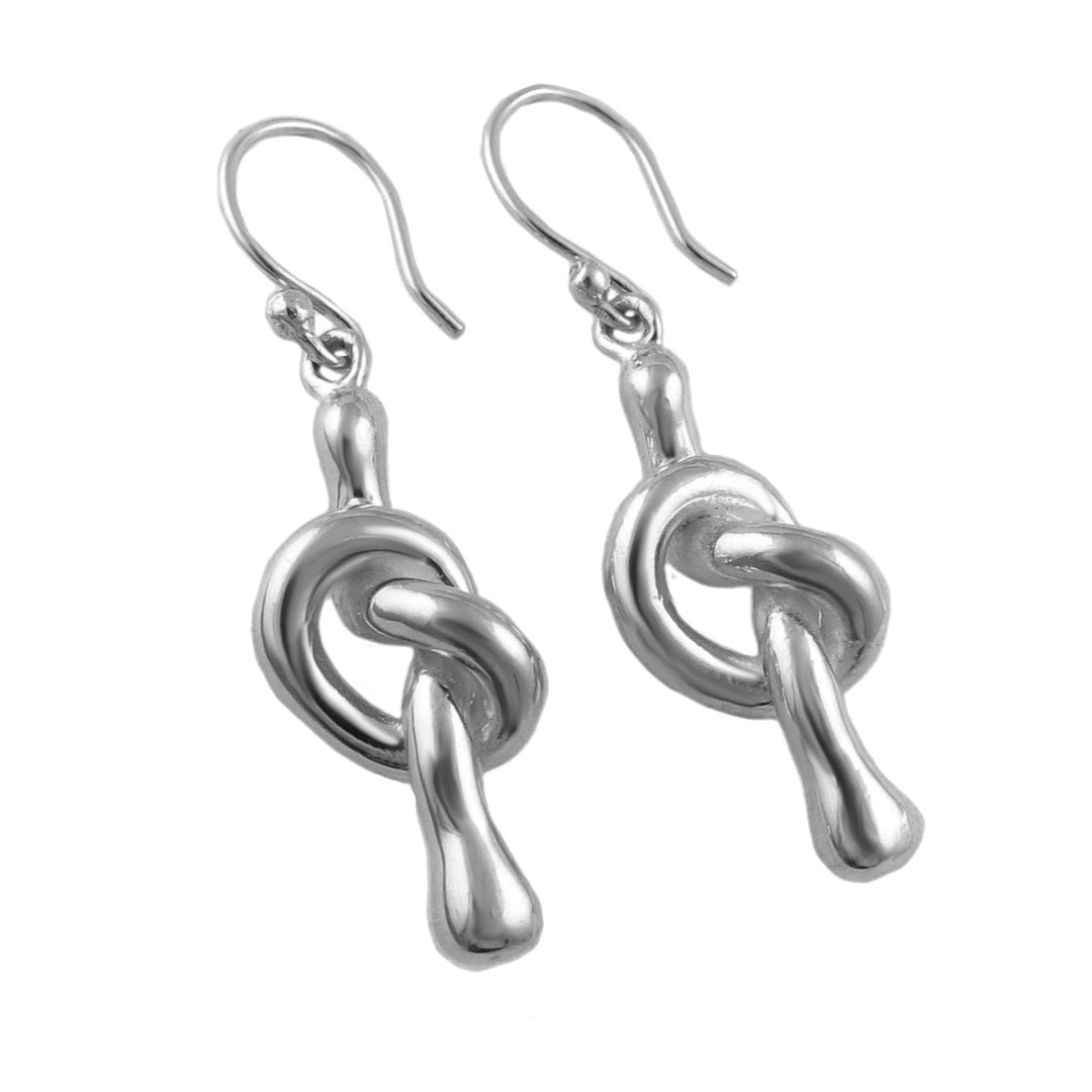 Sterling silver dangling love knot earrings on a white background