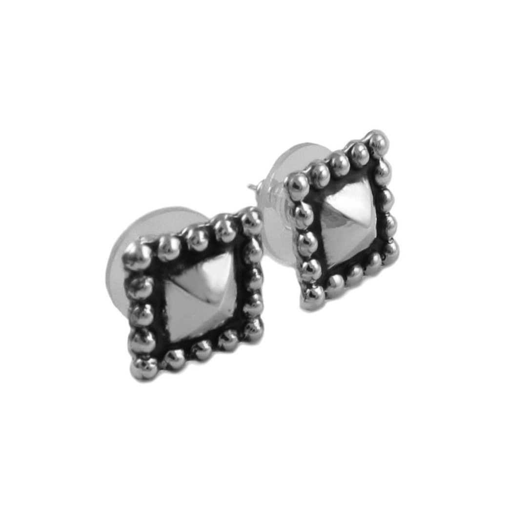 Pair of silver stud earrings with geometric design on a white background