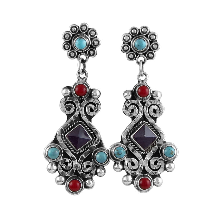 A pair of sterling silver dangle earrings with red and turquoise inlays, featuring amethyst gemstones and a blackened niello finish.