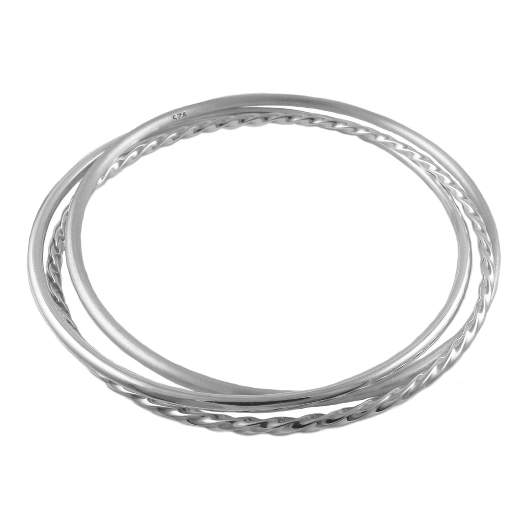 3 in 1 sterling silver bangles on a white background