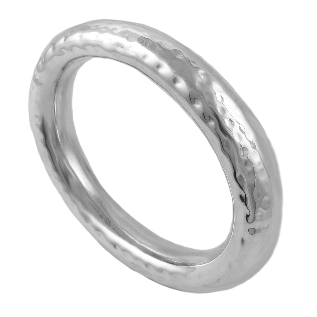A large sterling silver bangle with a hammered textured surface on a white background