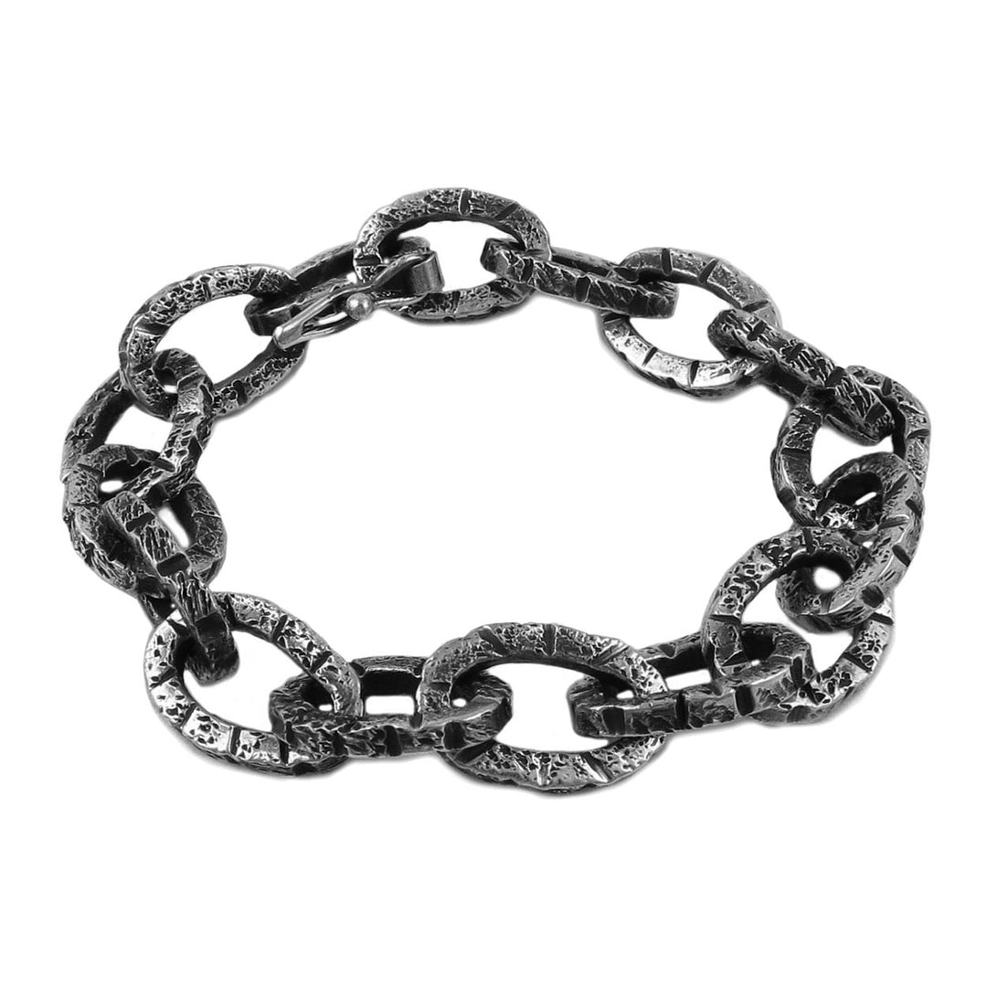 Brutalist matt battered chain bracelet in solid blackened silver on a white background