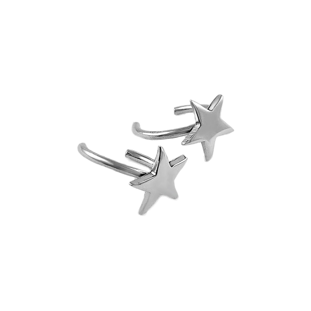 A pair of sterling silver ear cuff earrings with polished star accents on a white background.