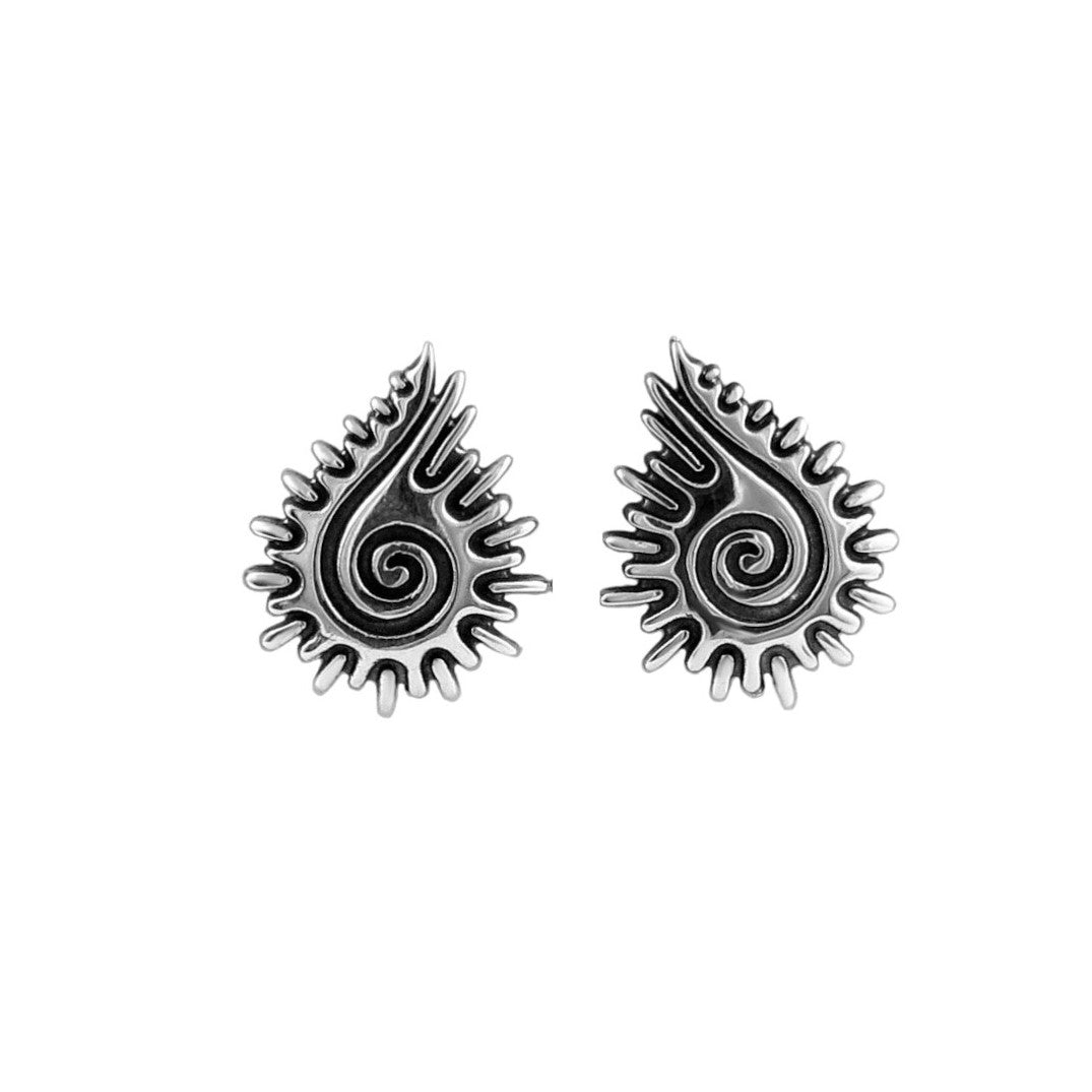 Pair of silver seashell stud earrings on a white background