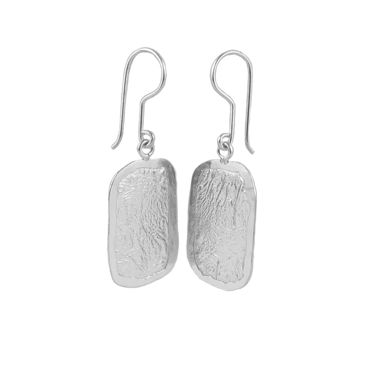 Rectangle drop sterling silver earrings with a crumpled surface finish on a white background.