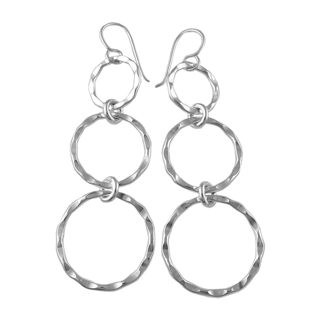 Long triple hammered circle drop earrings in 925 silver on a white background.