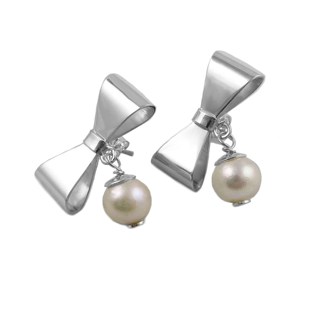 Sterling silver bow shaped earrings with faux pearls on a white background