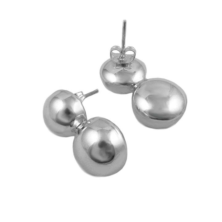 Double ball bead silver earrings on a white background