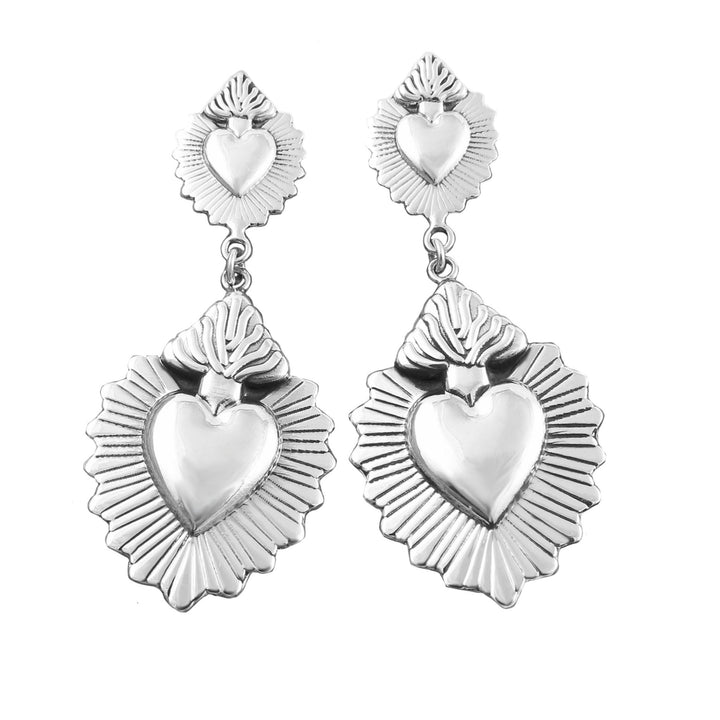 Flaming heart silver earrings on a white background