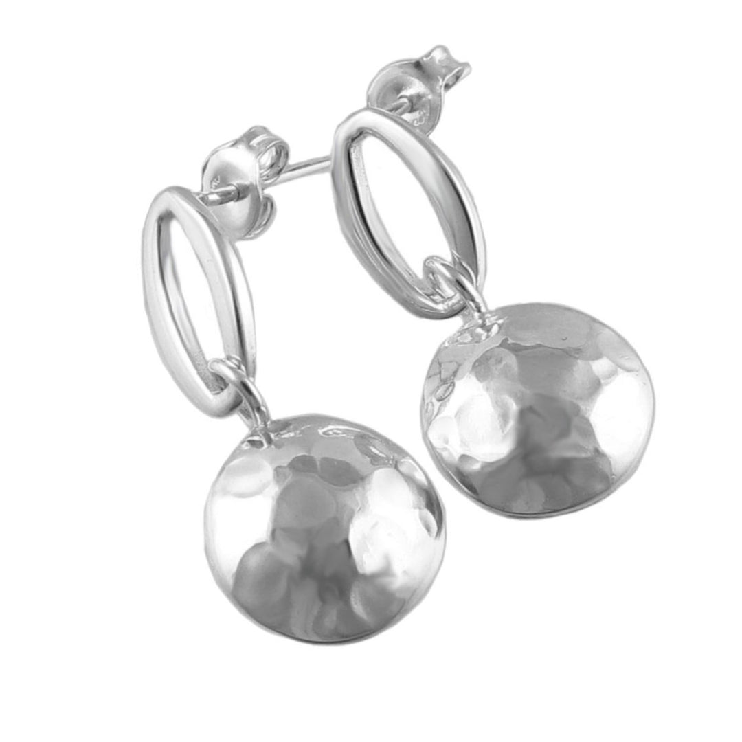 A pair of silver drop earrings with a hammered finish on polished oval frames.