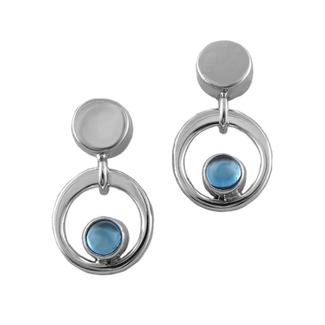 Silver earrings with blue topaz gemsstones on a white background