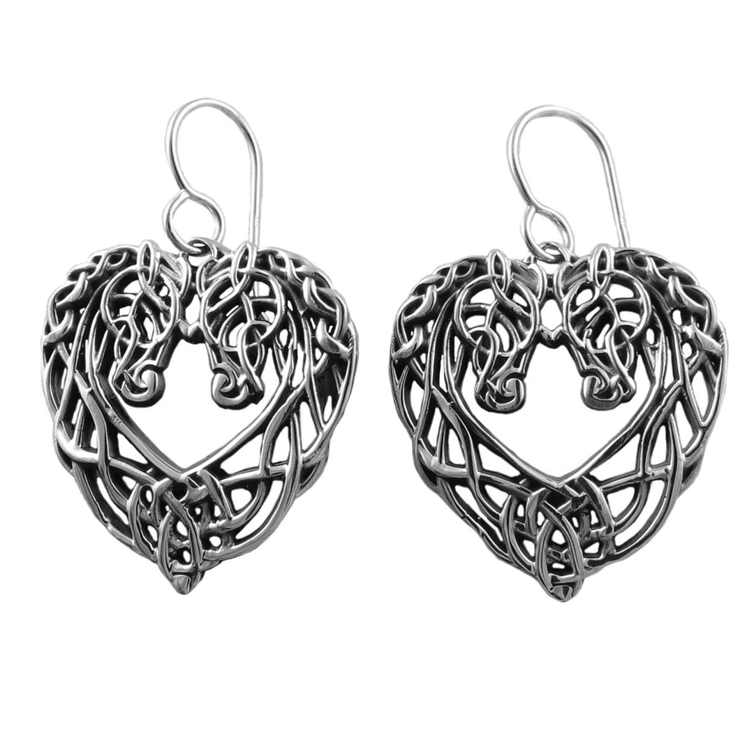 Silver heart-shaped horse head earrings with intricate designs on a white background