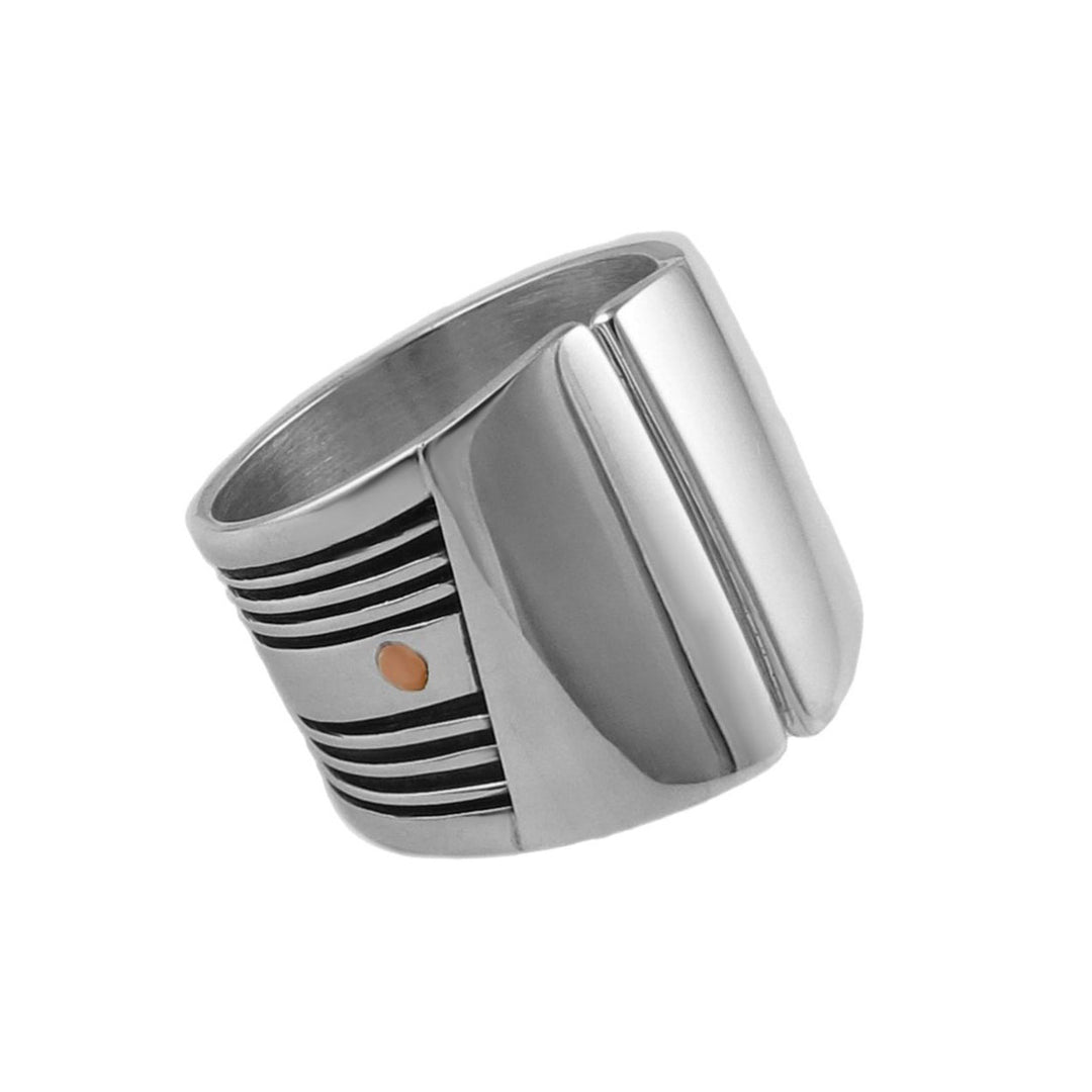 A sterling silver ring with copper accents, featuring a wide band with a split shank design.