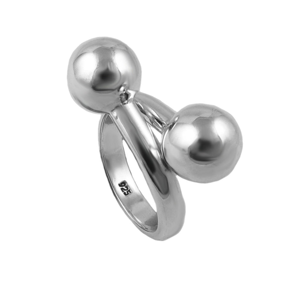A sterling silver ring with a crossover shank and ball beads on a white background.