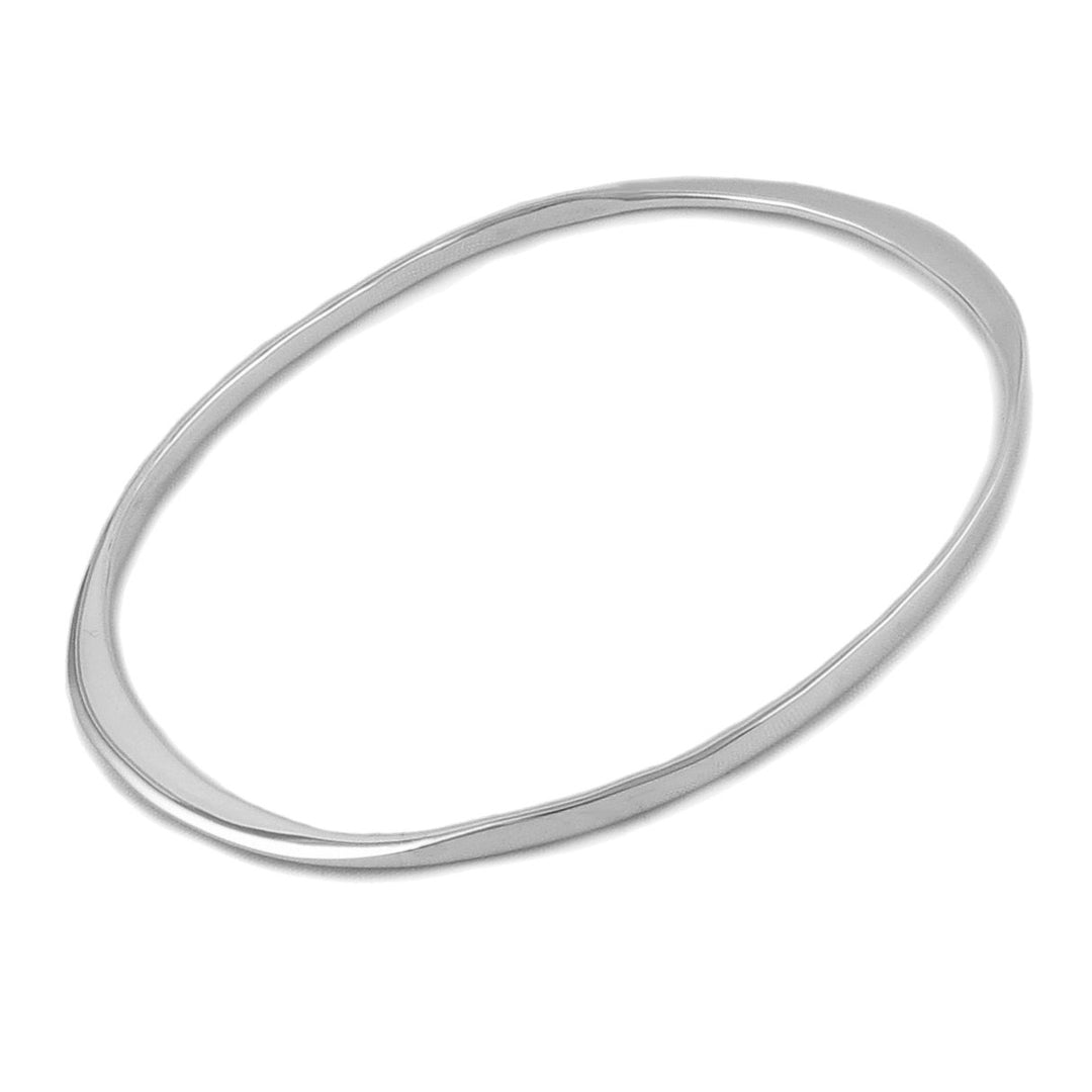 A polished silver oval bangle with a curved edge presented on a plain background.