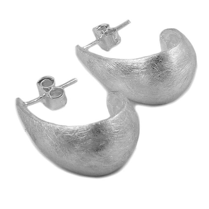 Sterling silver half hoop earrings with a brushed finish on a white background.