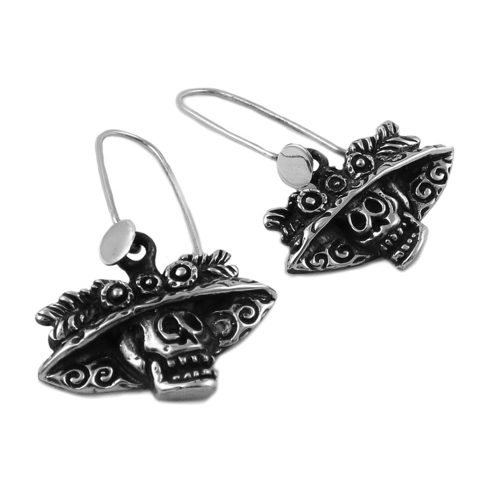 Day of the dead silver earrings on a white background