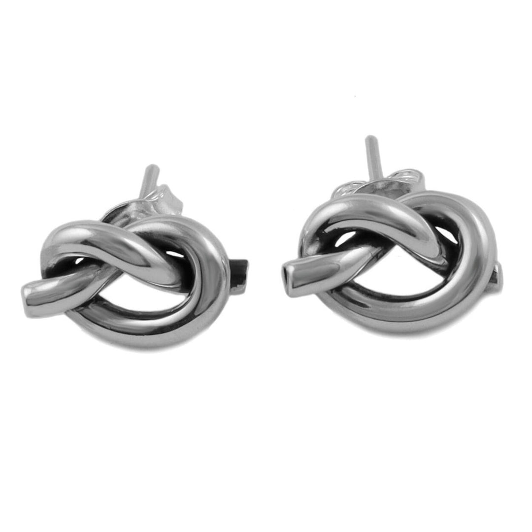 A pair of sterling silver stud earrings featuring a knotted love knot design.