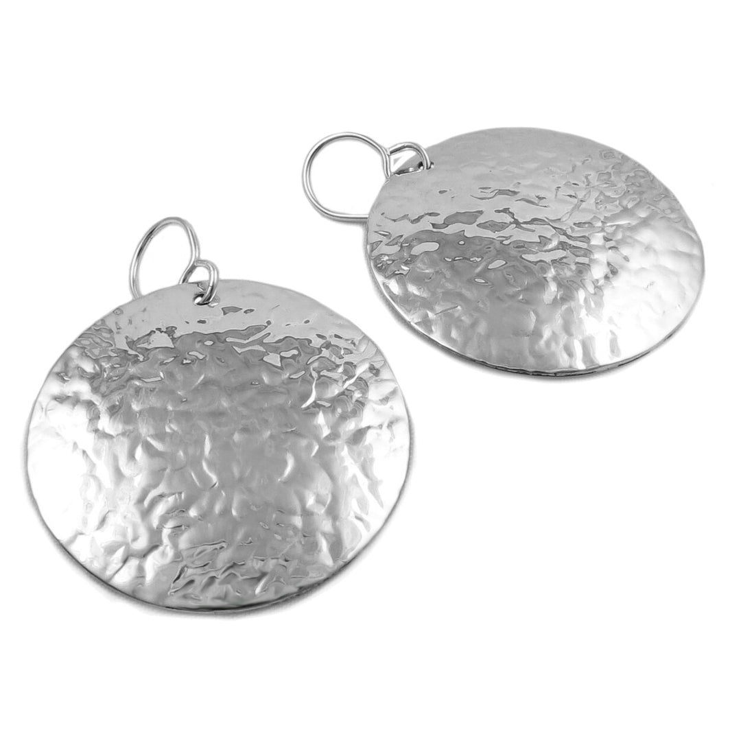 Large hammered circle disc earrings on a white background