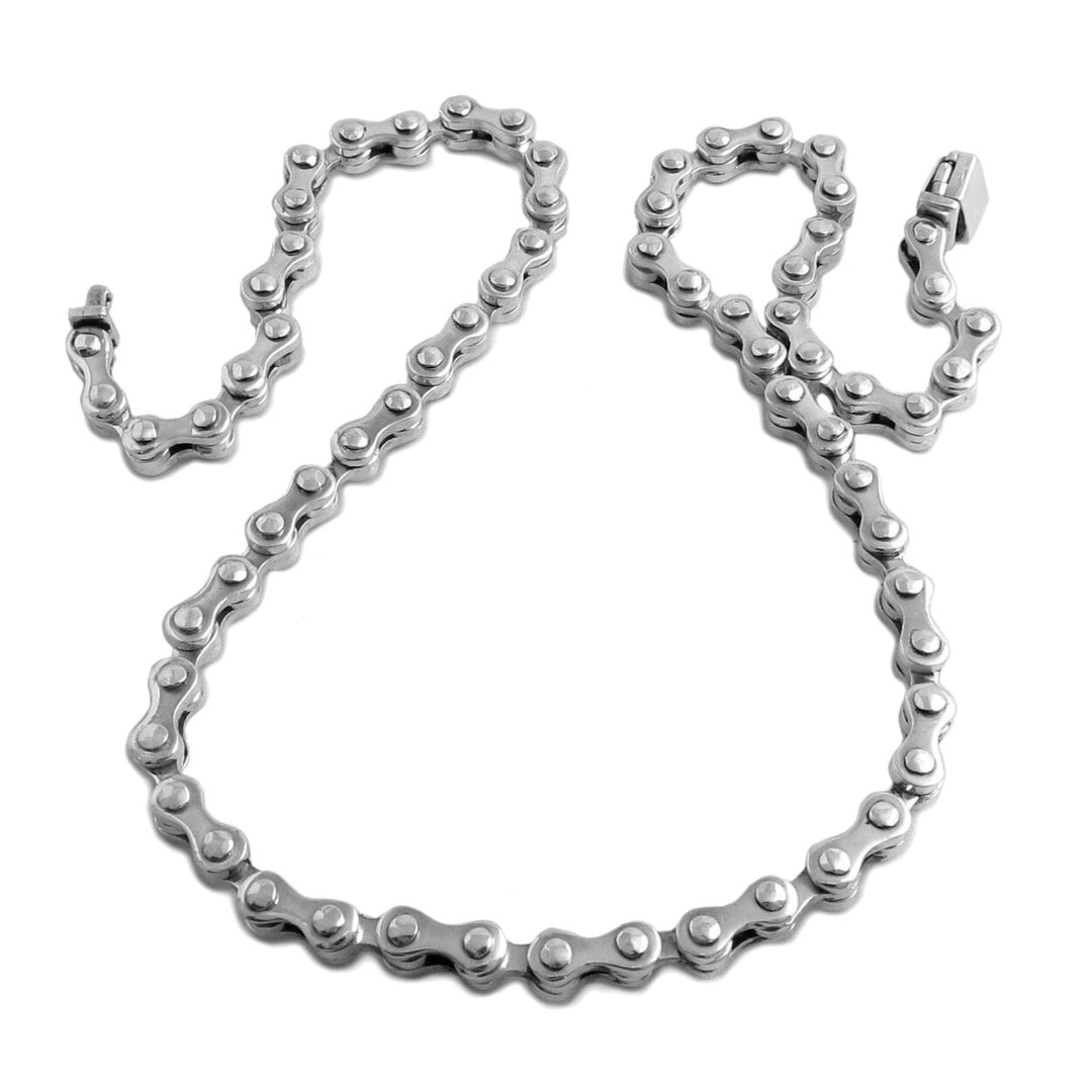 A chunky sterling silver motorbike chain link necklac on a white background.