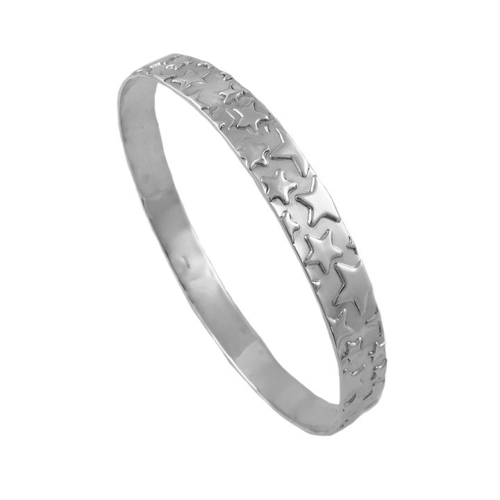 A large silver bangle decorated with a raised celestila star pattern.