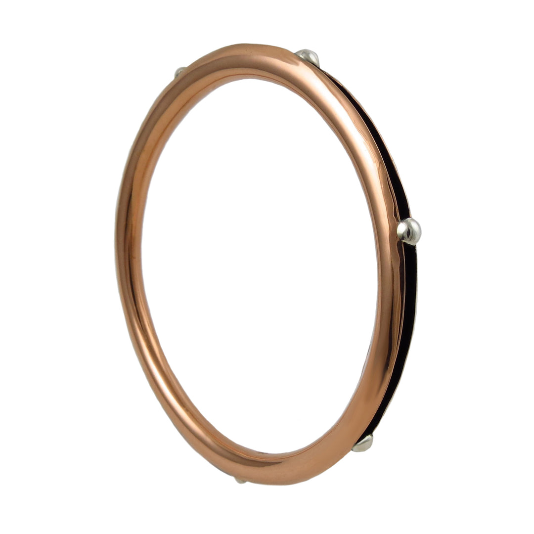 Large copper and 925 silver bead circle ladies bangle on a white background