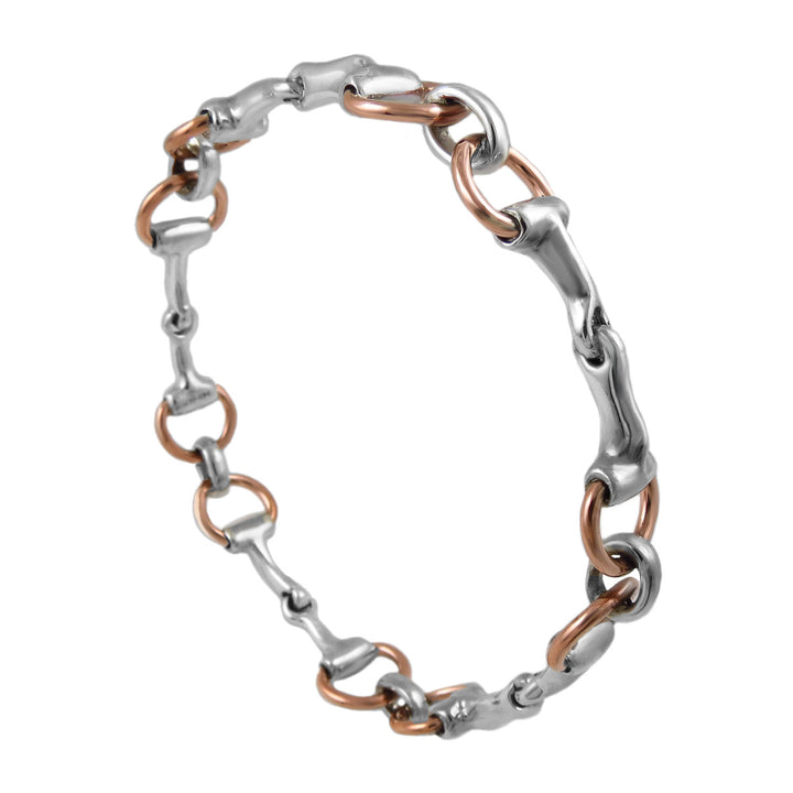 Equestrian sterling 925 silver and copper rigid horse snafflebit bangle on a white background