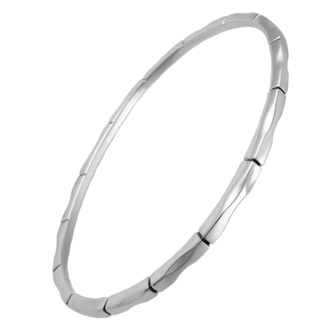 Sterling 925 silver bangle with a curved edge and a bamboo pattern on a white background. 