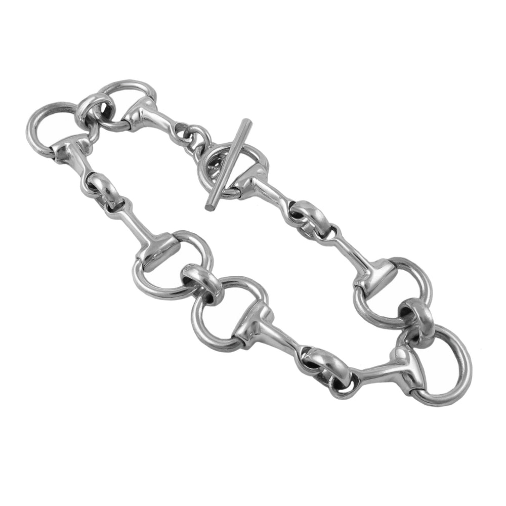 A sterling silver bracelet designed to resemble a horsebit snaffle, with oval links and heavy silver snaffles.