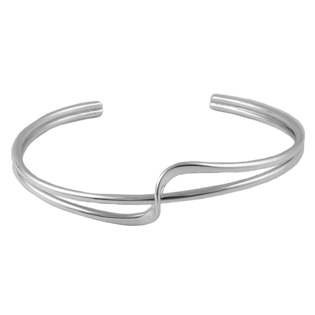Silver bracelet cuff with a fornt twist accent on a white background