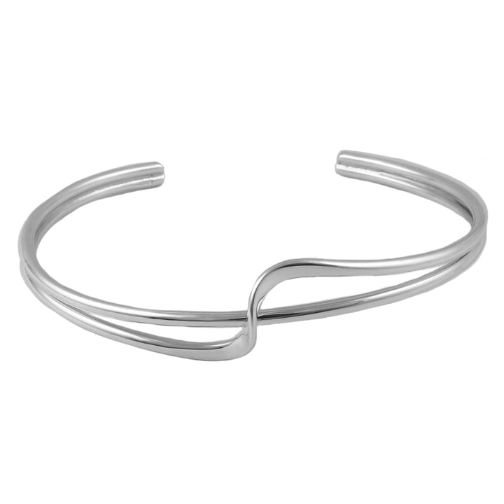 Silver bracelet cuff with a fornt twist accent on a white background