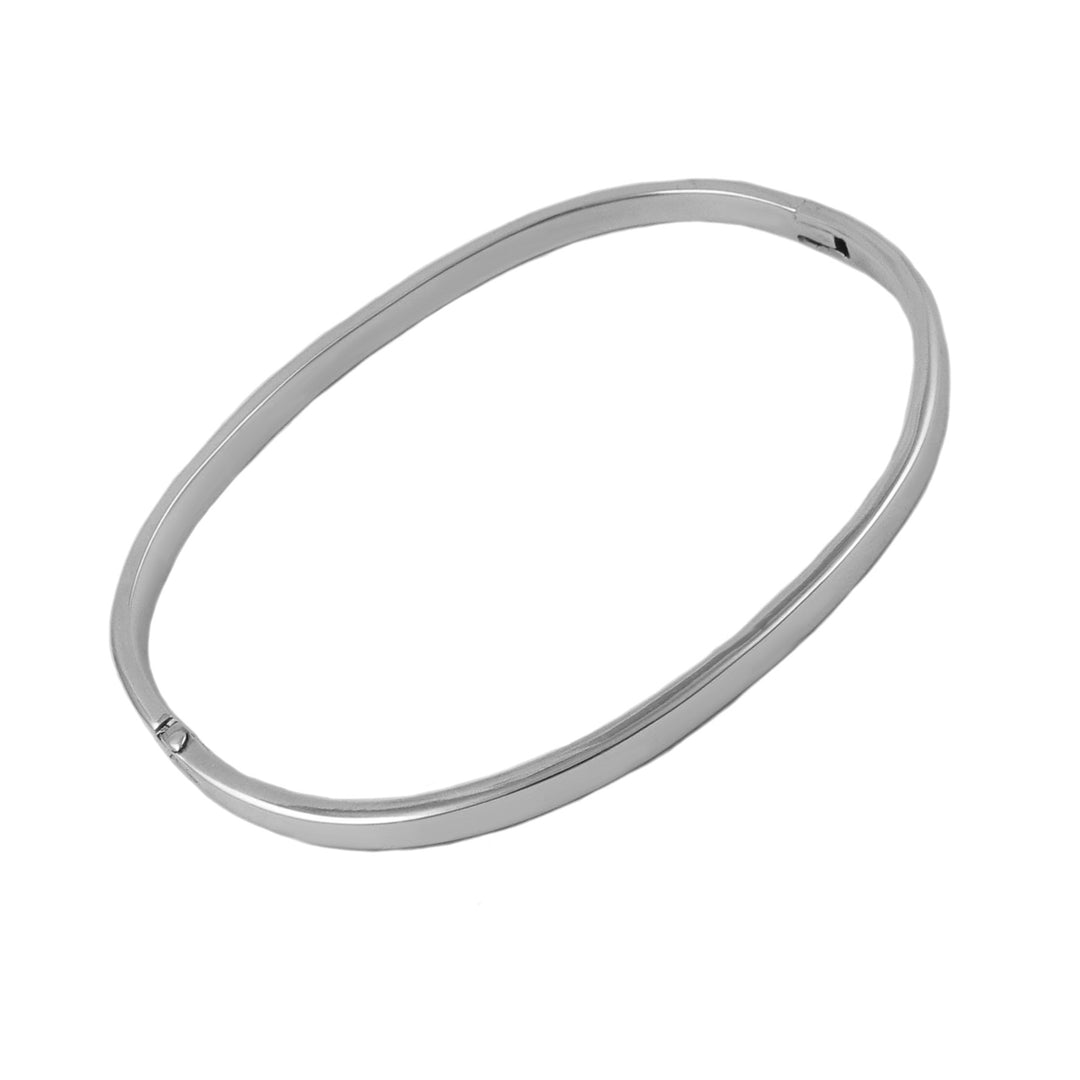 Solid oval sterling islver bangle bracelet on a white background