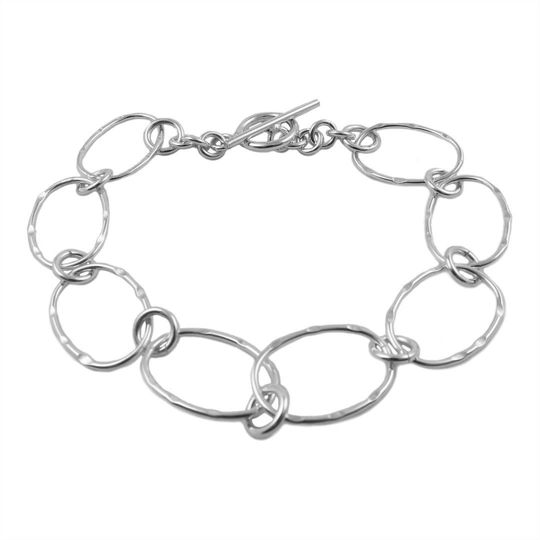 Silver wide link chain bracelet on a white background