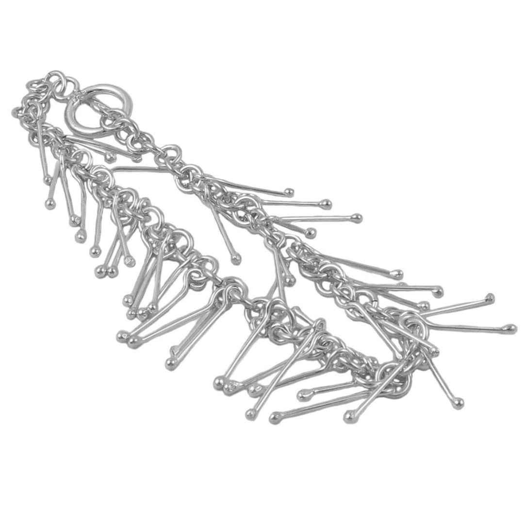 Sterling silver bracelet featuring long stick clusters on a white background. 