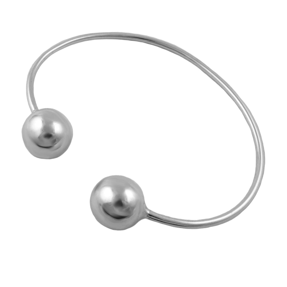 A minimalist UK hallmarked sterling 925 silver open cuff bracelet featuring two polished spherical bead accents on the ends, shown against a solid white background.