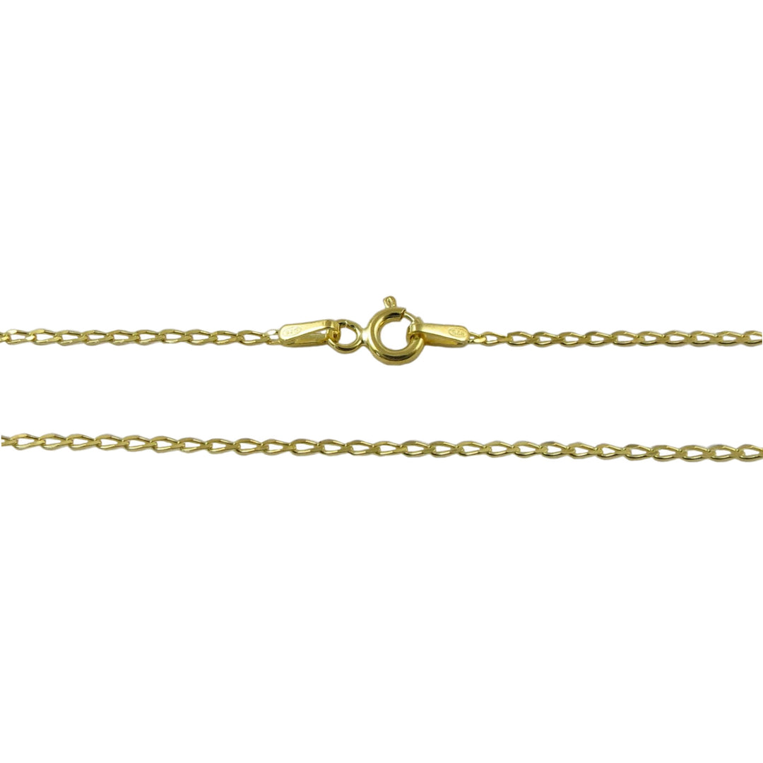 Gold curb chain necklace on a white background