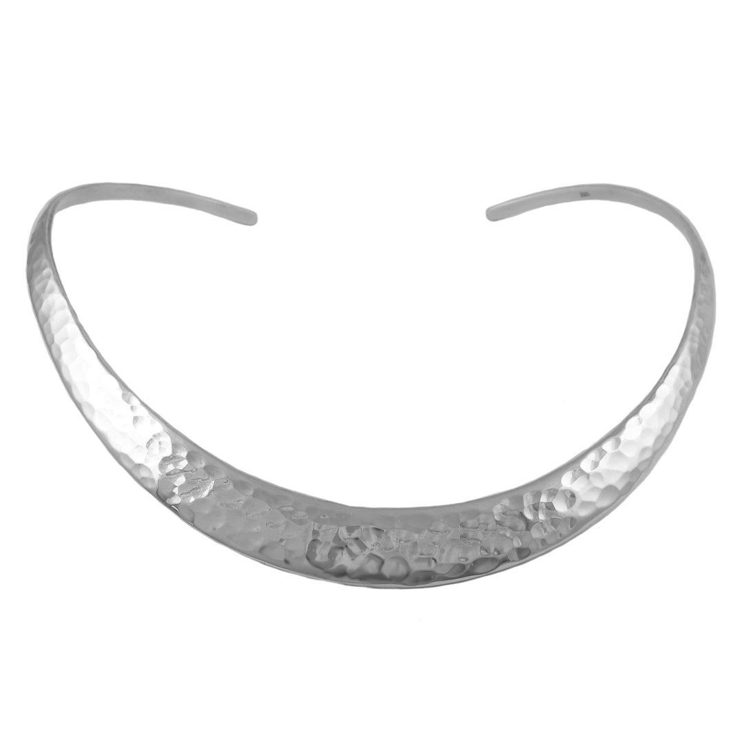 Silver choker necklace with a hammered finish on a white background