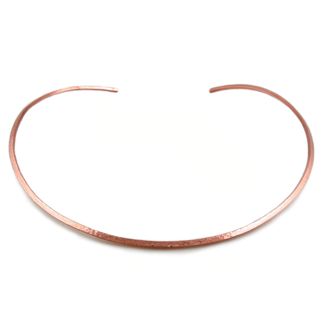 Hammered copper choker necklace for women on a white background
