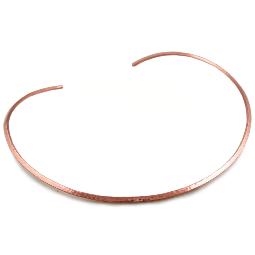 Hammered copper choker rigid necklace for women on a white background