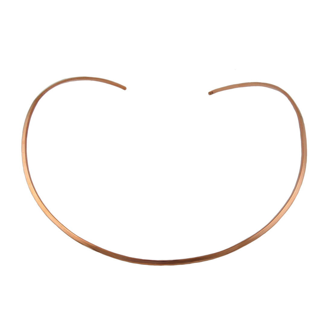 A large polished solid copper choker necklace torque for women on a white background