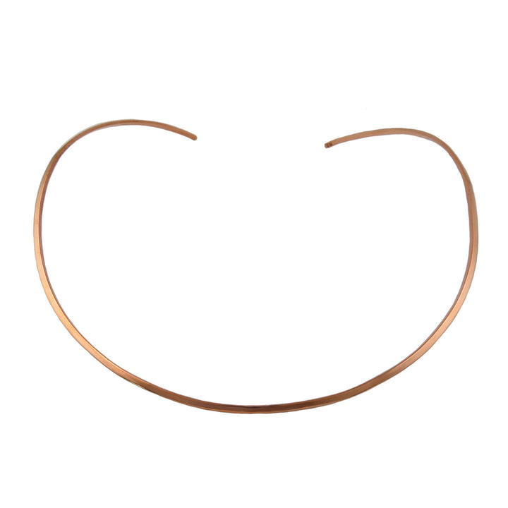A large polished solid copper choker necklace torque for women on a white background