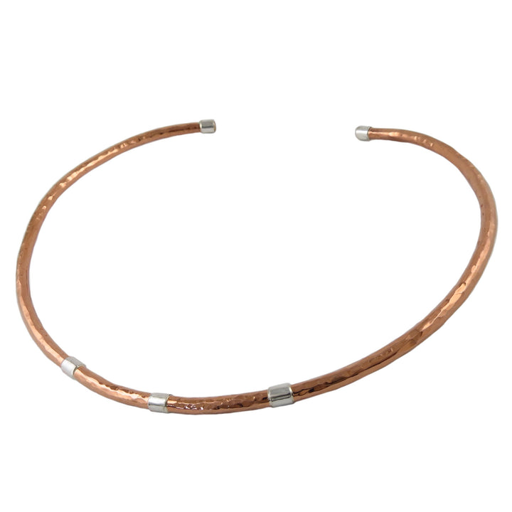 Hammered solid copper choker fitted necklace for women with 925 silver accents on a white background