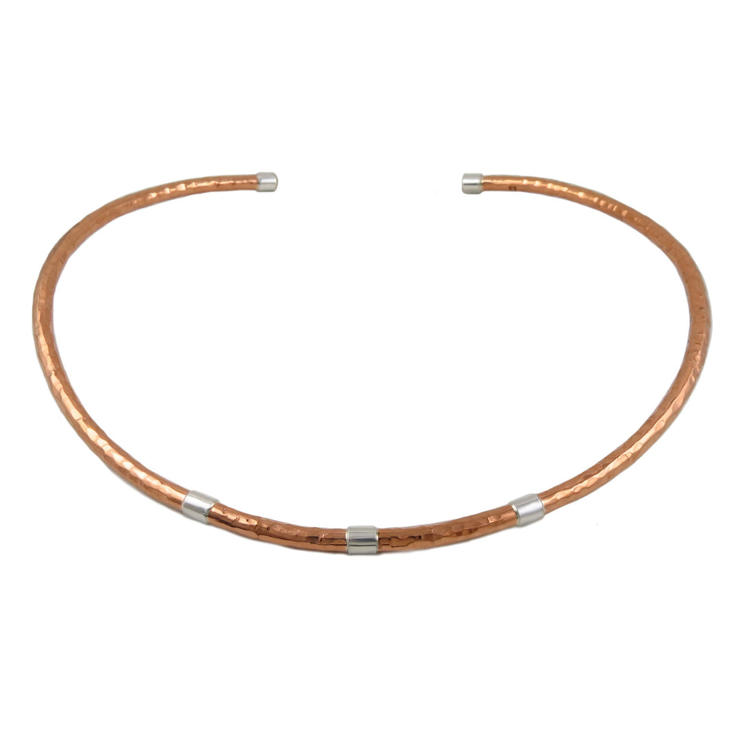 Ladies copper choker necklace with silver accents on a white background